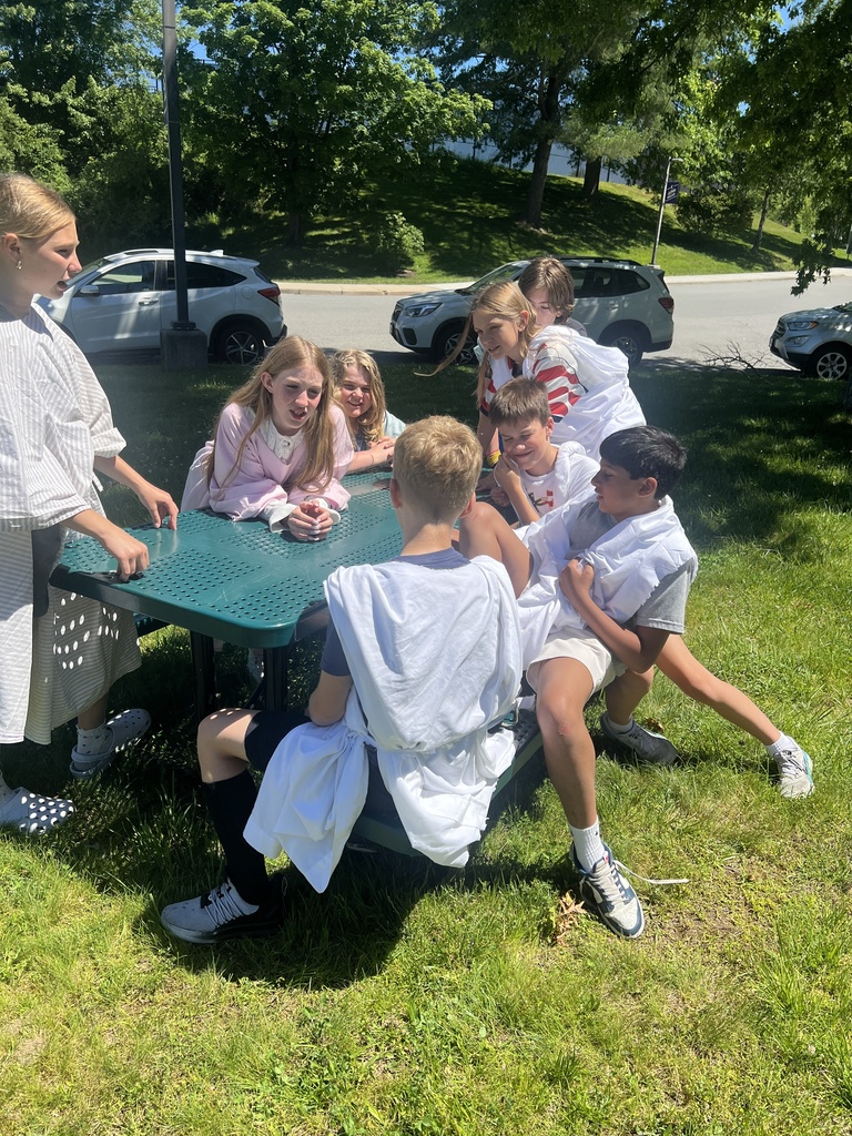 students sitting outside