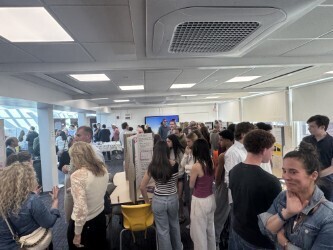 students standing with posters