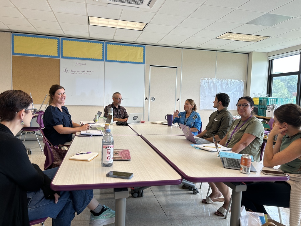 teachers sitting at table