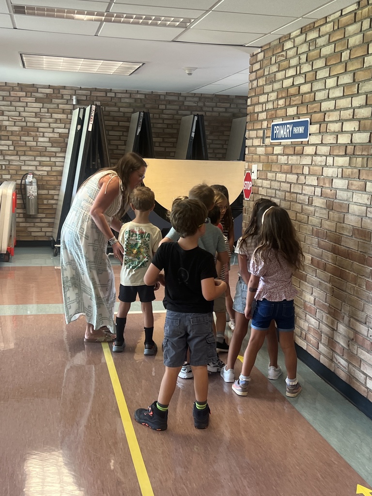 students and teacher walking