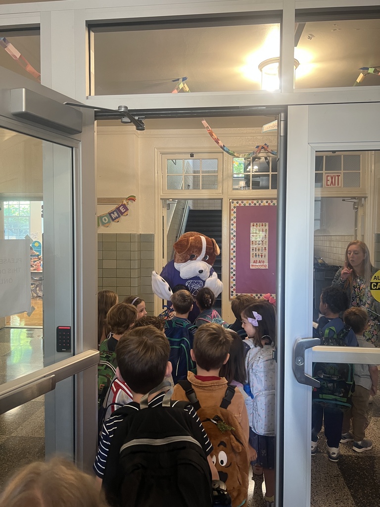 students in hallway with mascot