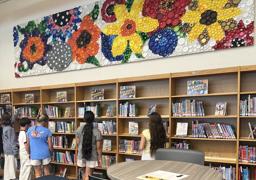 students looking at books