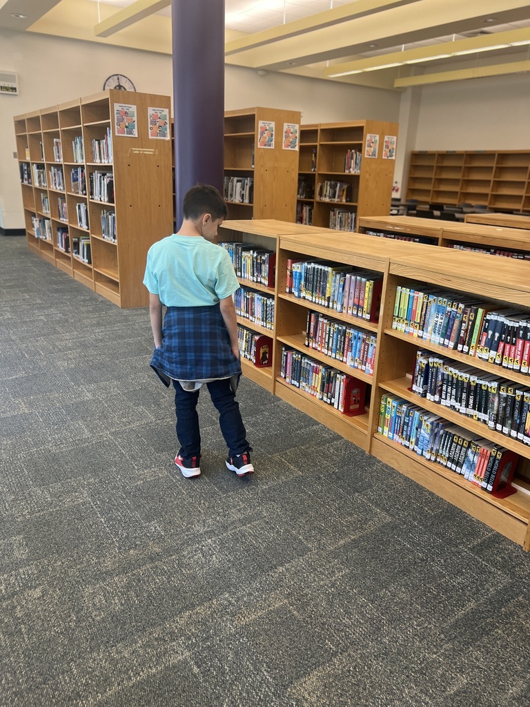 students looking at books