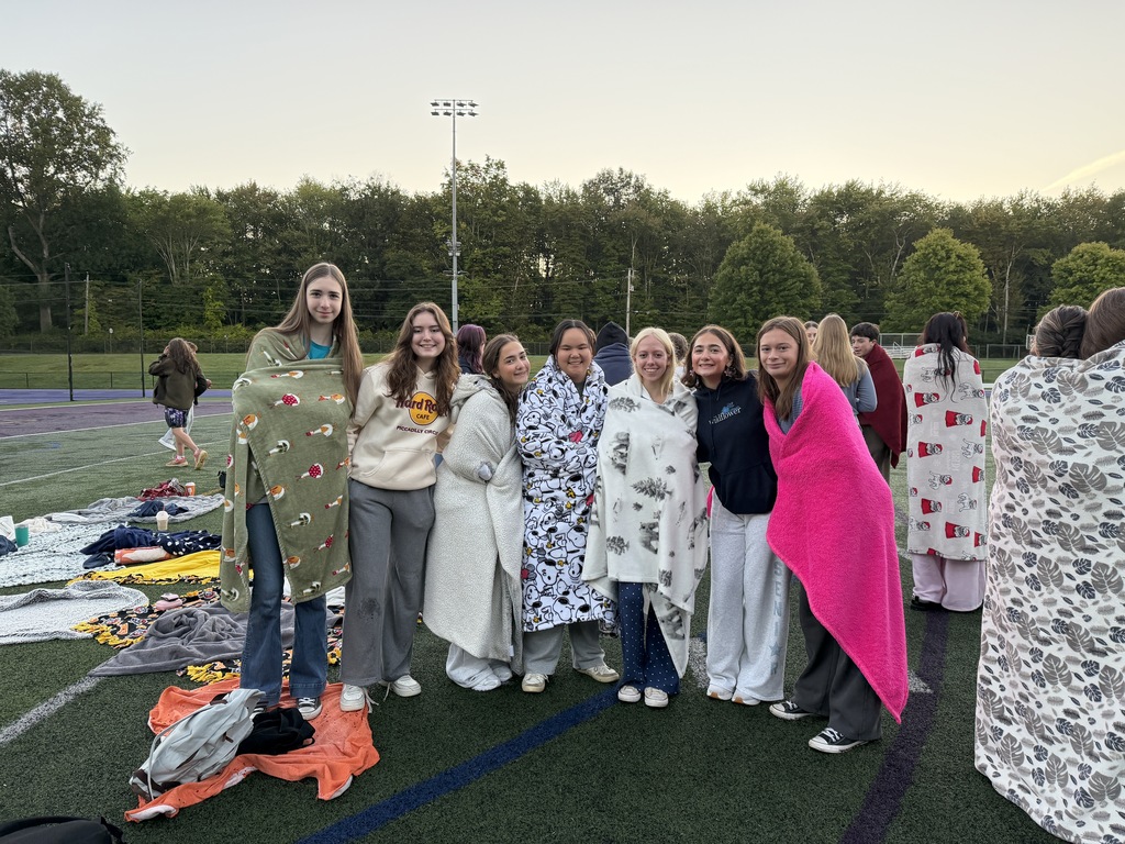 students standing outside on field