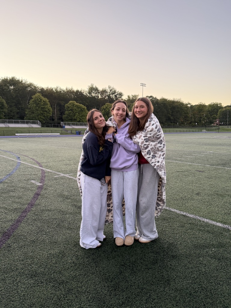 students standing outside on field