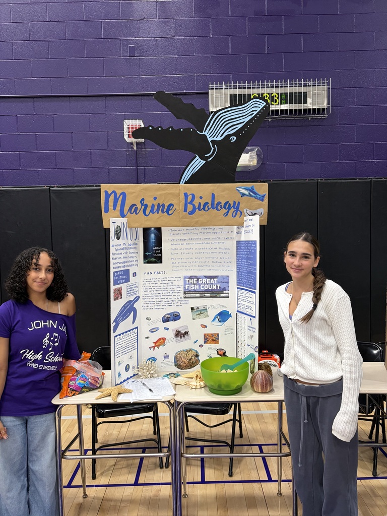 students standing with poster