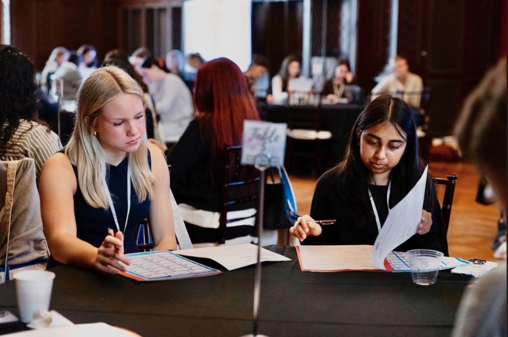 students sitting at desk writing