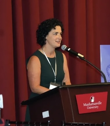 adult speaking at podium
