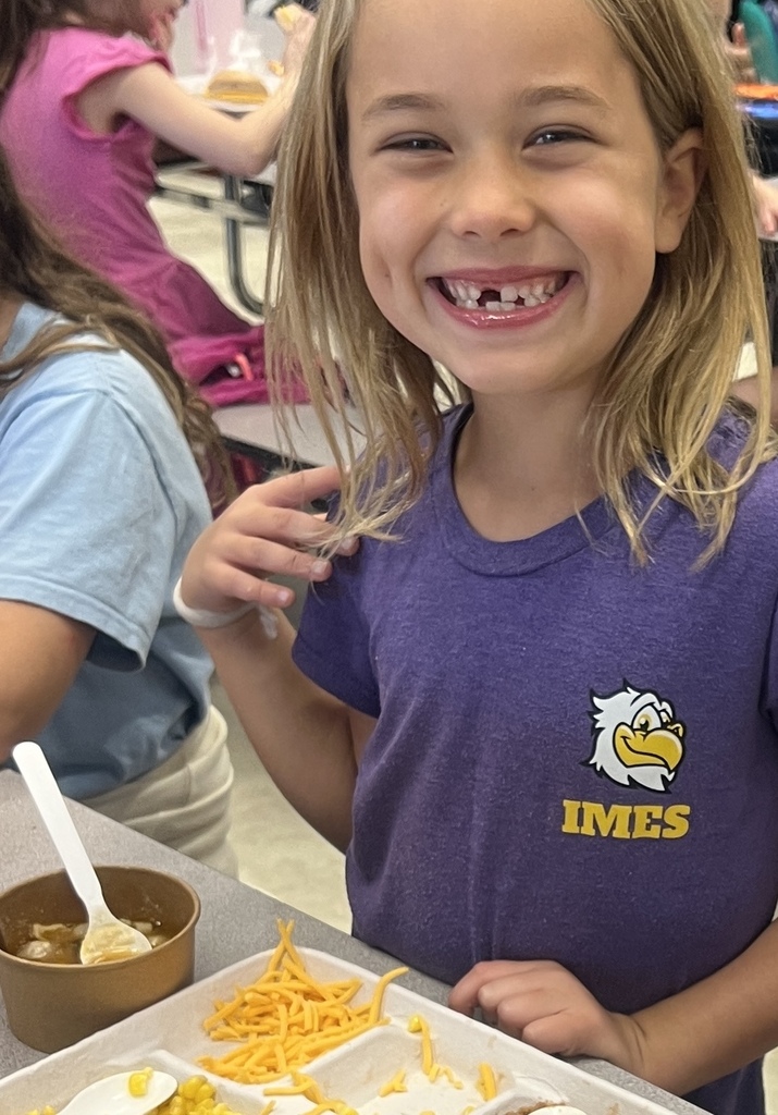 student eating soup