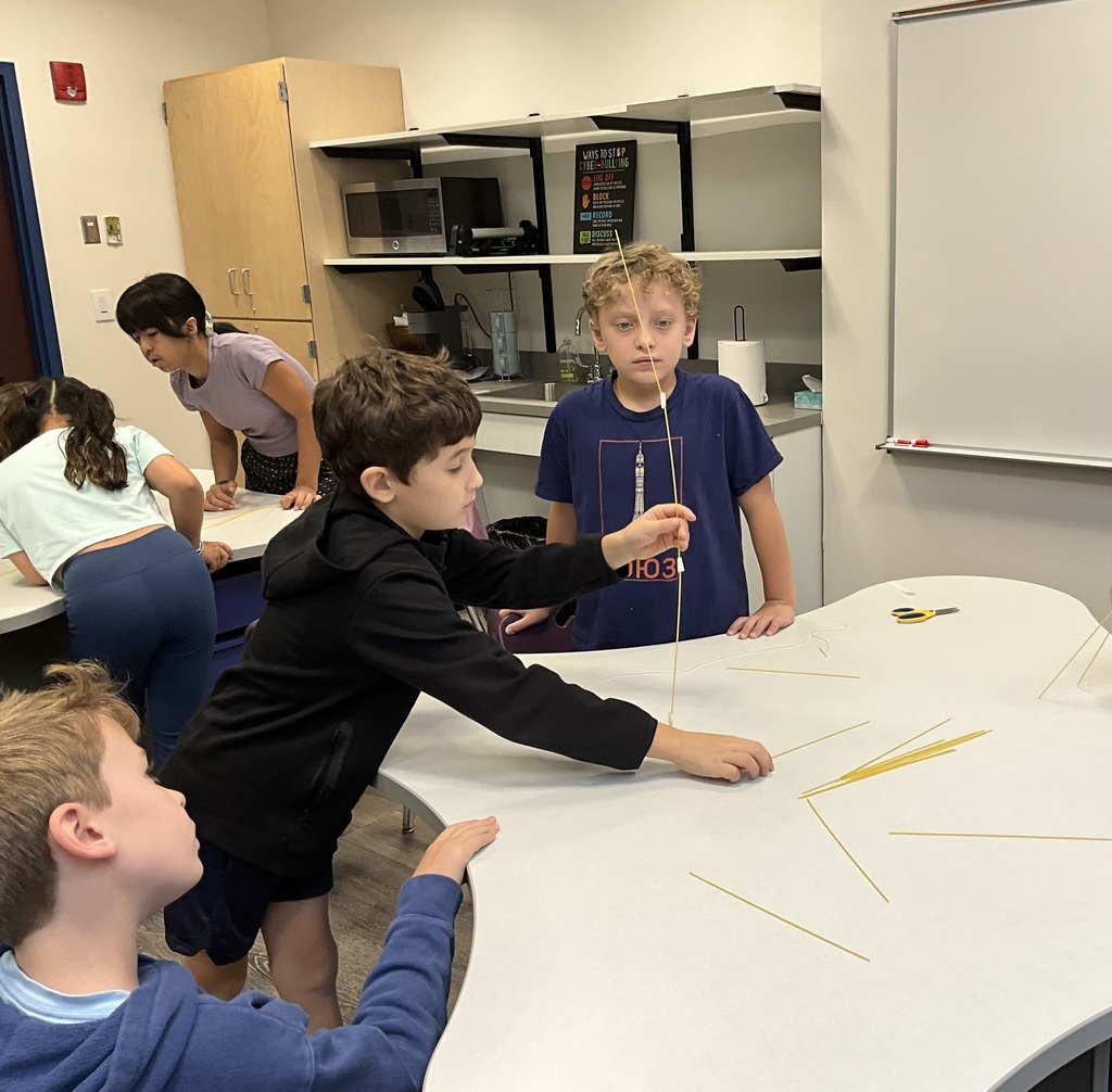 students standing at desk