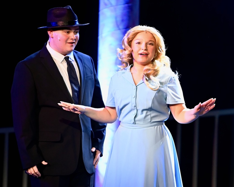 student singing on stage