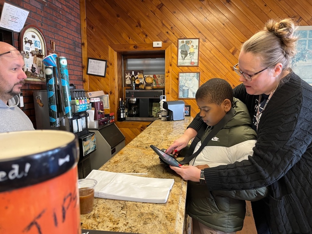 Using communication devices at Big Nicks to order Lunch