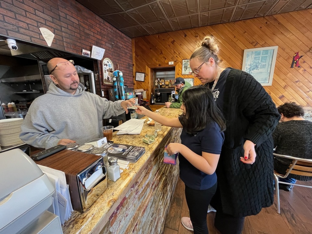 Using communication devices at Big Nicks to order Lunch