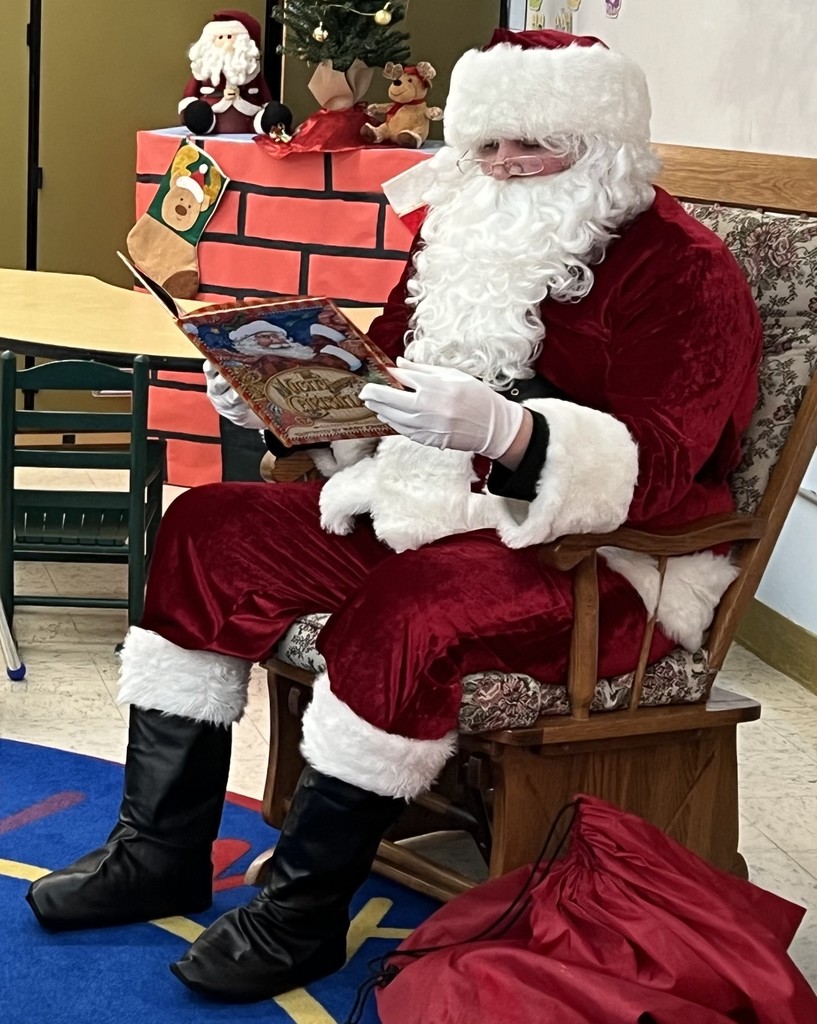 Santa reading a book
