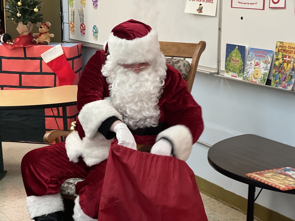santa getting gifts out of a bag