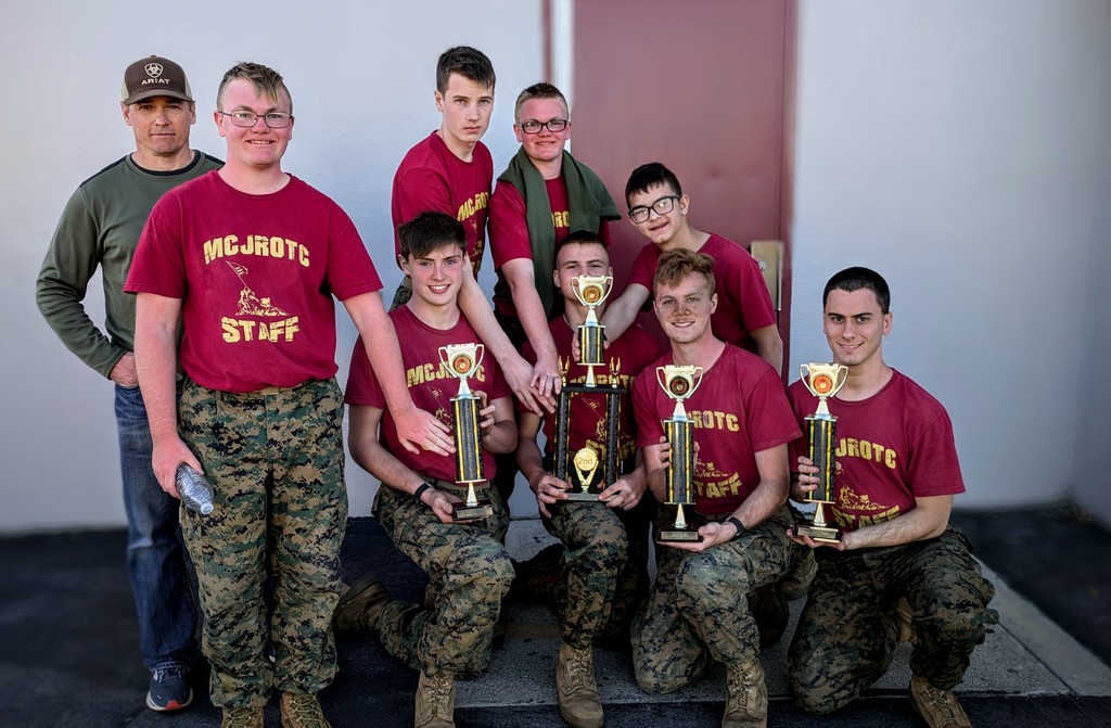 ROTC students holding a trophy