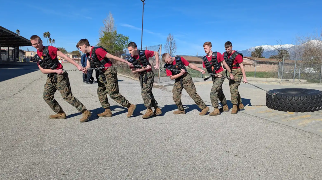 Students pulling a tire in a contest