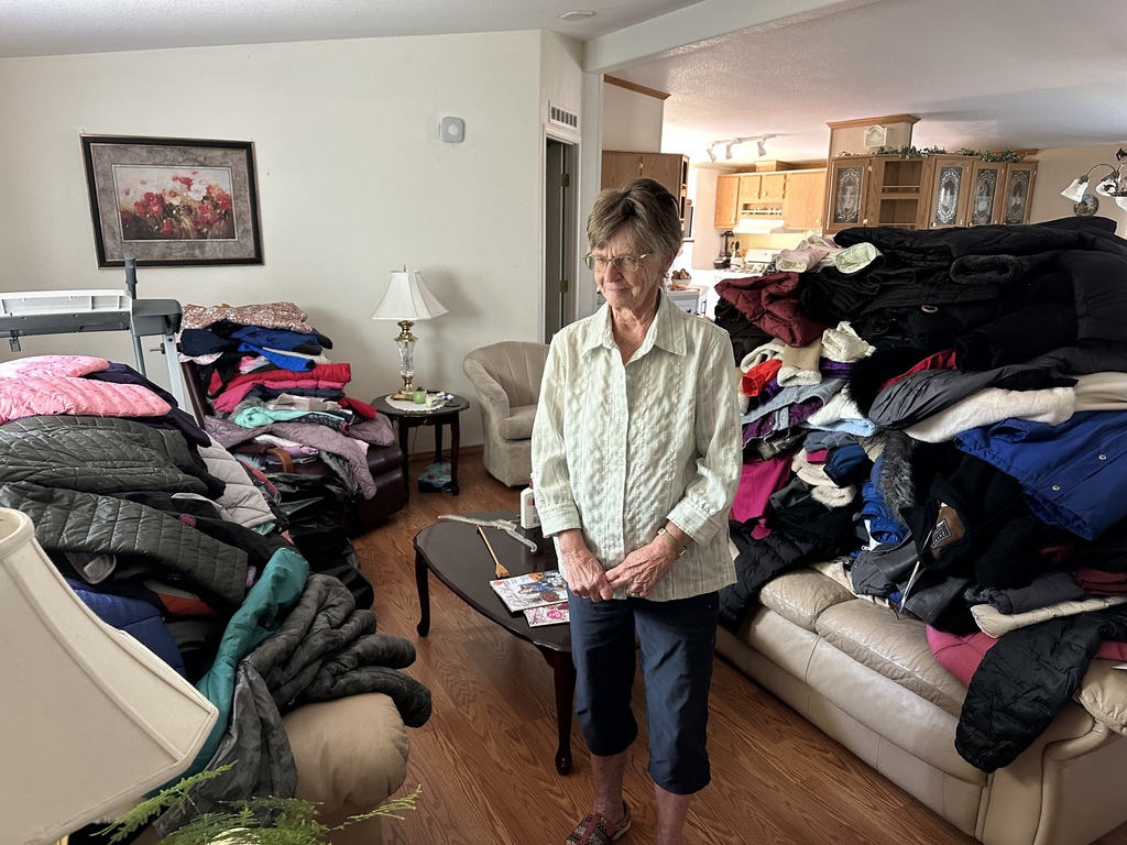 woman posing with coats