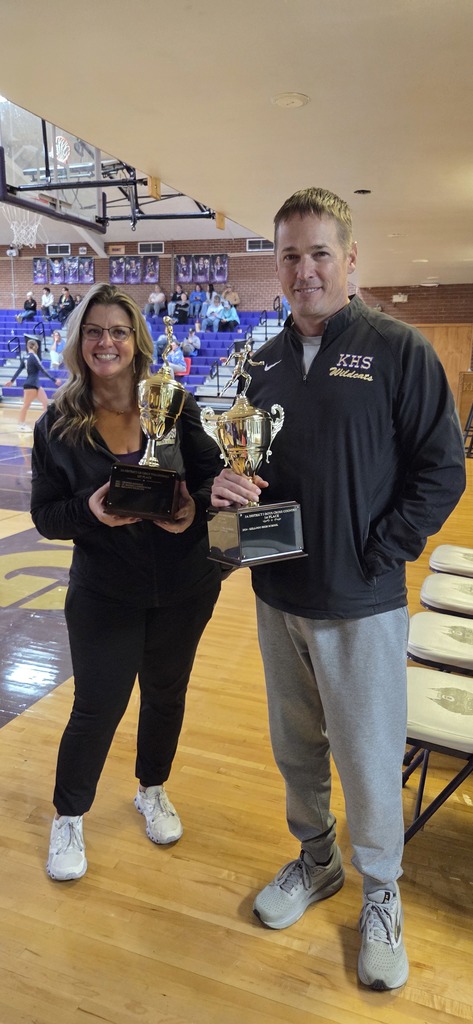coaches with trophies