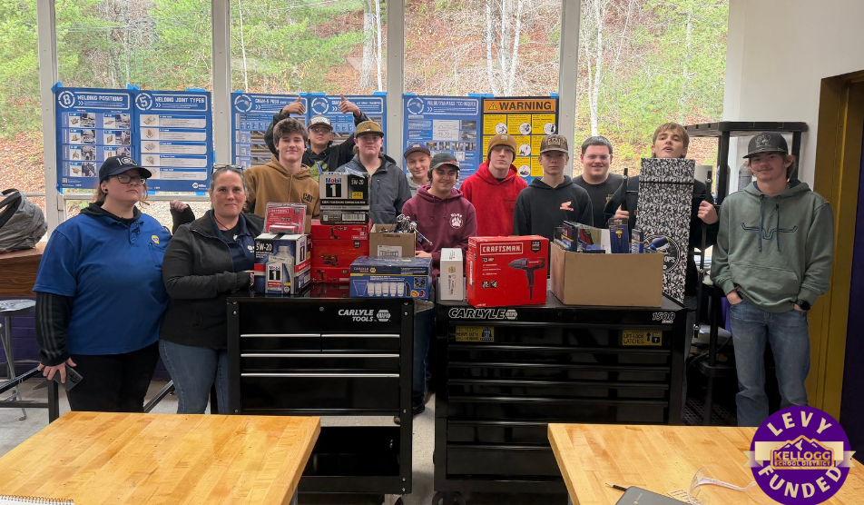 students posing with gifts
