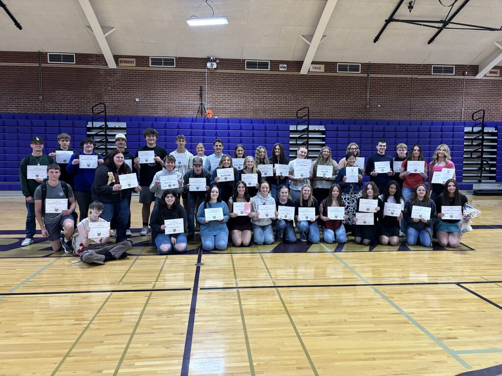 Students posing with awards