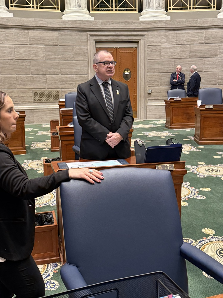 cinder Burger meeting with eighth grade students sharing about his story.