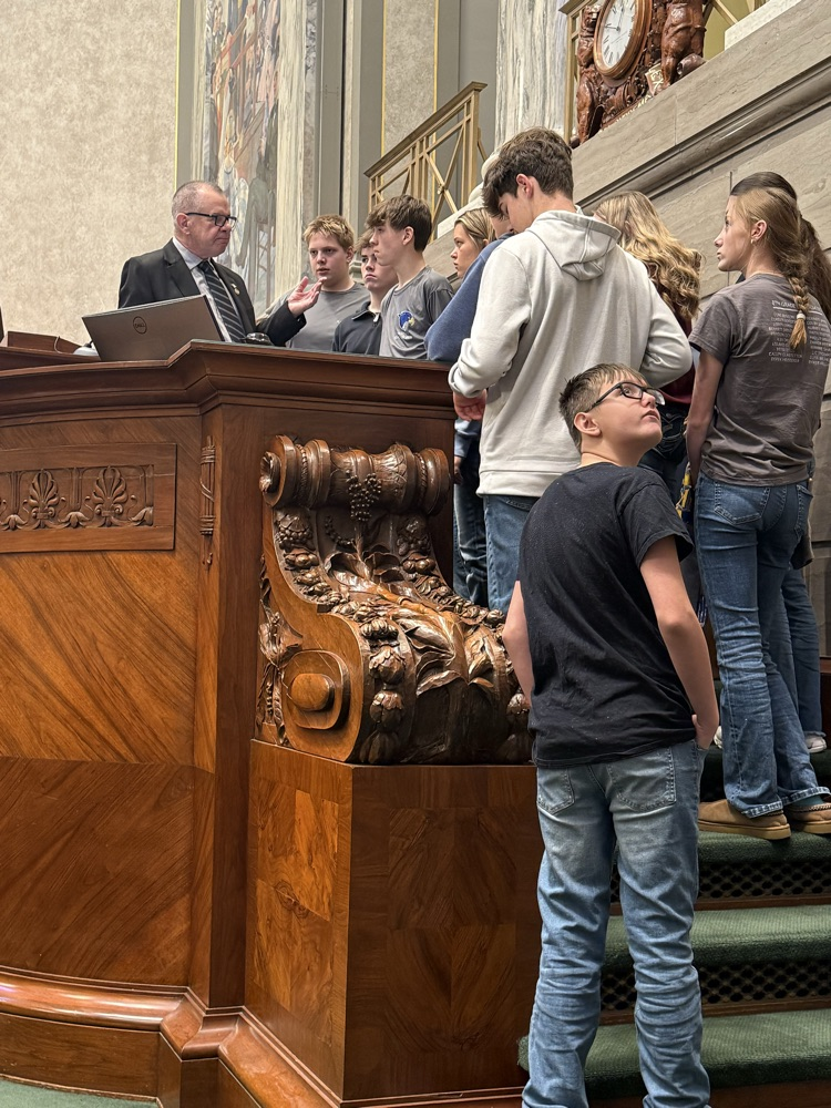 senator Burger sharing with  students the legislative process  of the Senate floor.