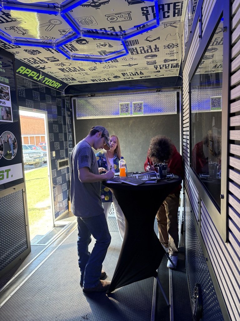 KTCT students viewing the inside of the State Tech trailer.