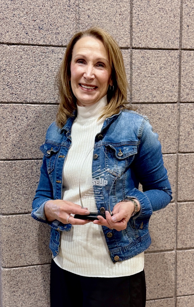 Susan Swift with Rise Up Award Trophy