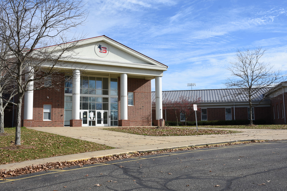 Picture of the outside of Stanton Middle School, brick building, blue sky