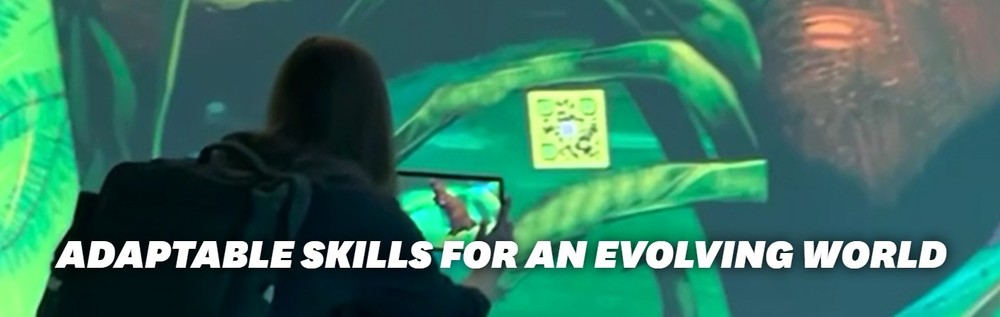 Student with back pack using technology in an aquarium green light with words written in white adaptable skills for an evolving world