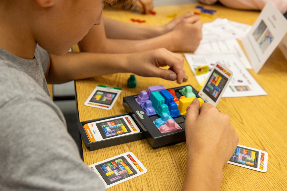 A Kent Elementary School student participates in a SUMM Family Math Night game.
