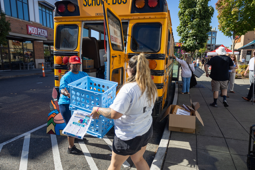 Volunteers load donated school supplies during the annual Fill the Bus event.
