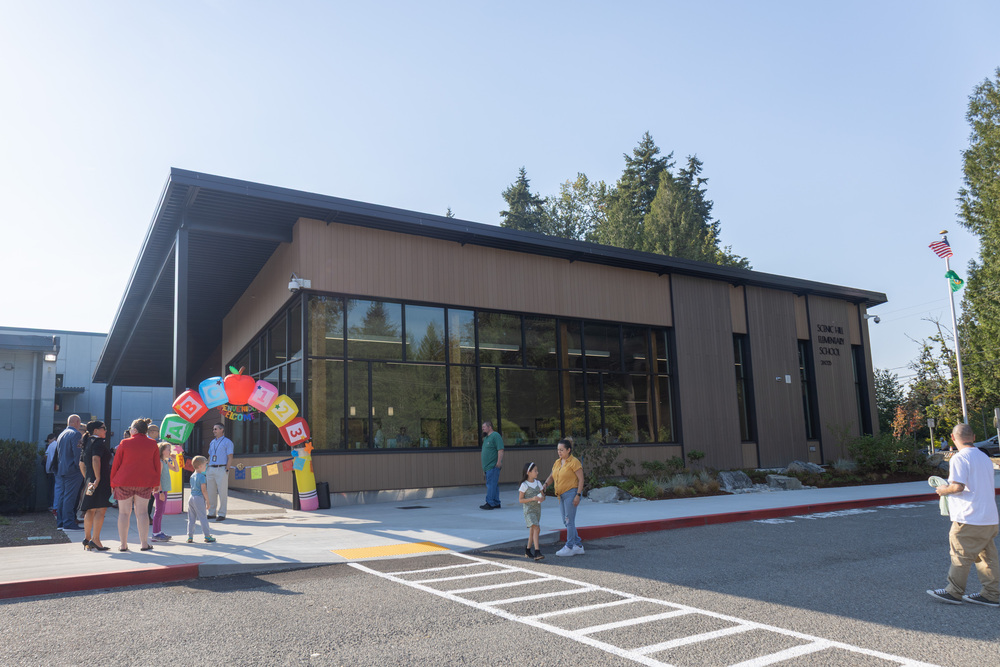 Visitors arrive for the library and media center ribbon-cutting ceremony at Scenic Hill Elementary School.