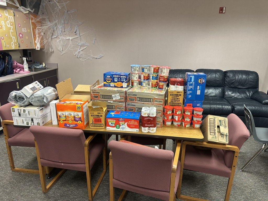 A table that is full of non-perishable food that was donated by the Northwood Community