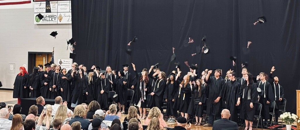 Graduates throwing hats
