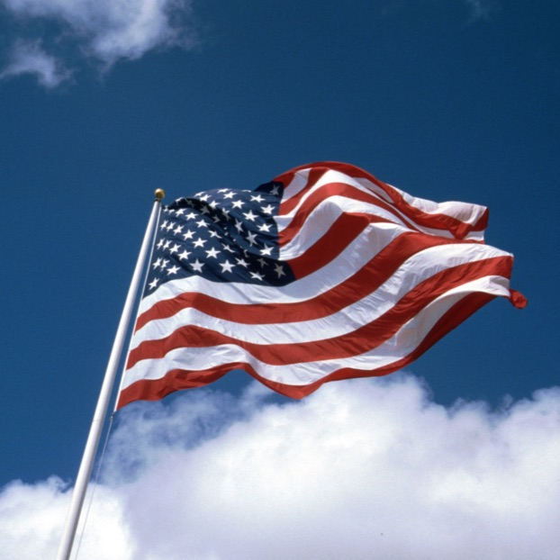 Image of American Flag with sky in the backgroun