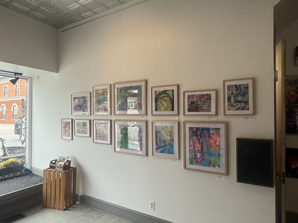 Mrs. Hartke stands in front of her artwork at The Gallery in the Valley