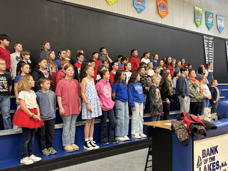 students singing at the. Veterans Program