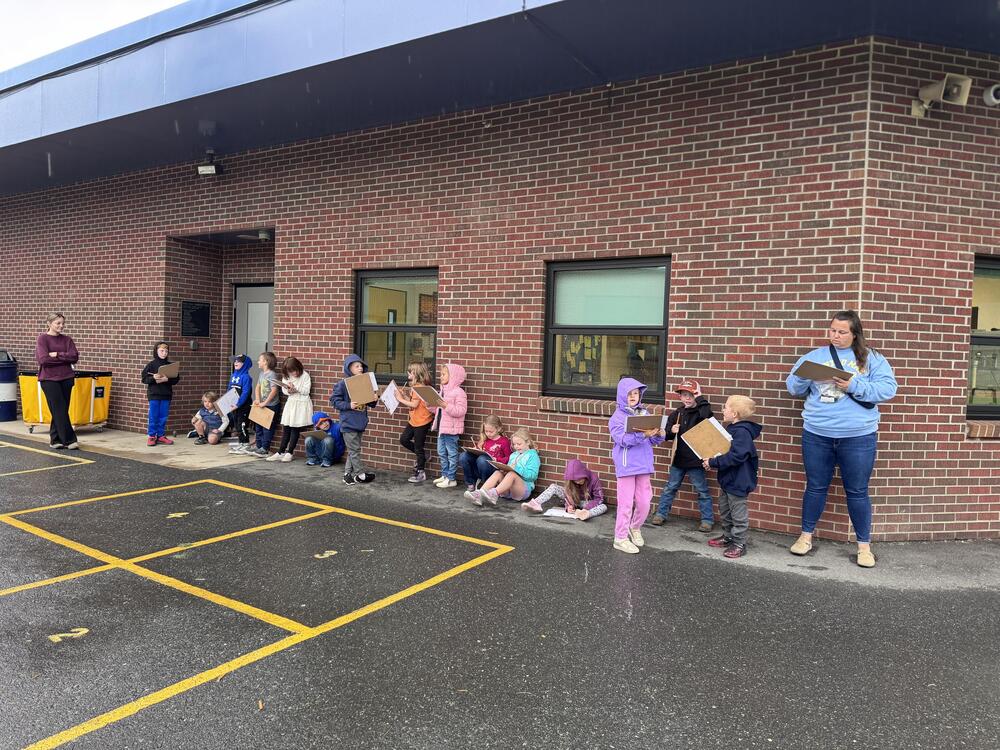 Students doing science observations outside.