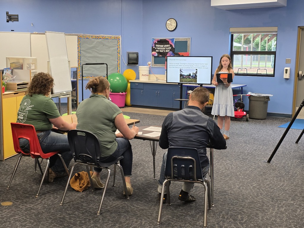 Student presenting passages to a panel