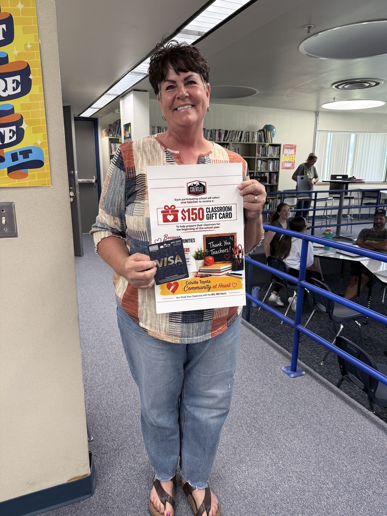 Paula  with her gift card from Colville Toyota