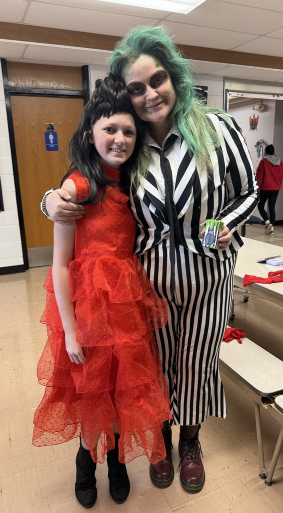 teacher dressed as Beetle Juice and student as Lydia