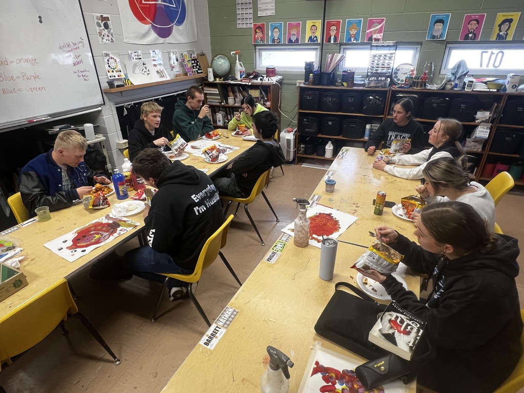 students at tables practicing their one-act lines over lunch