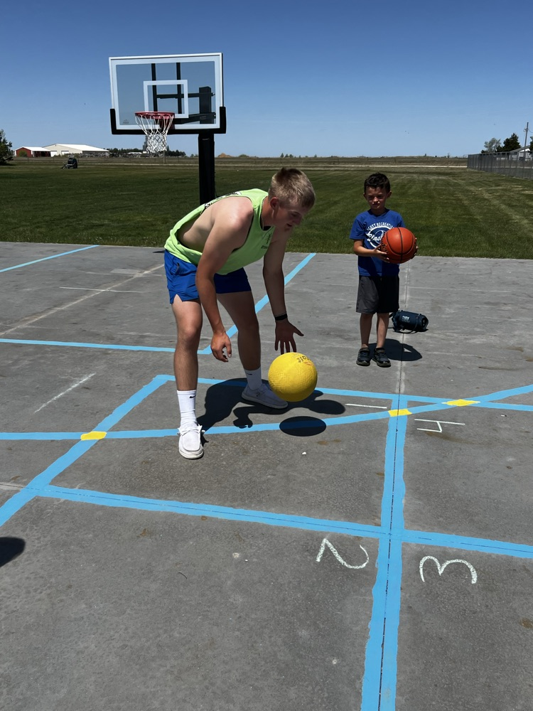 playing four square with a big kid
