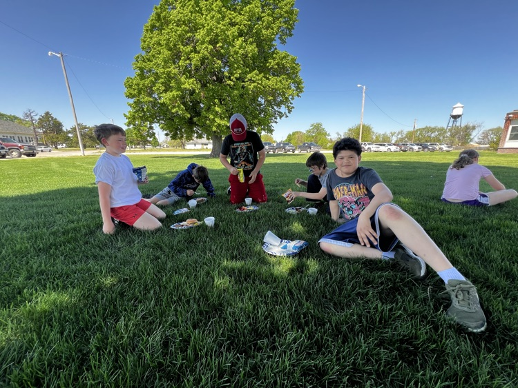 two boys on lawn eating