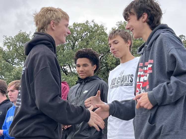 Nate shaking hands with competitors 