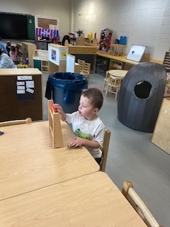 Student playing with abacus