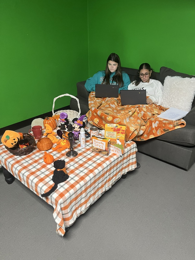 Performing Arts students enjoy a cozy, fall vibe as they create a project