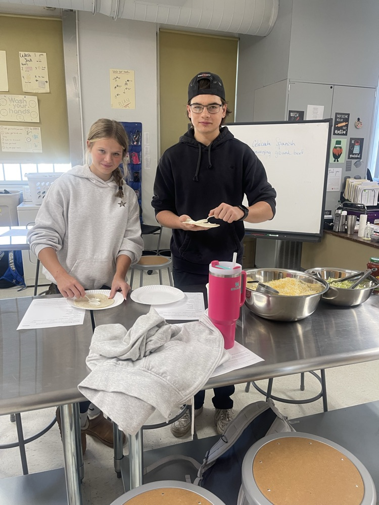 Adding topping to our tacos!! 🌮🌮